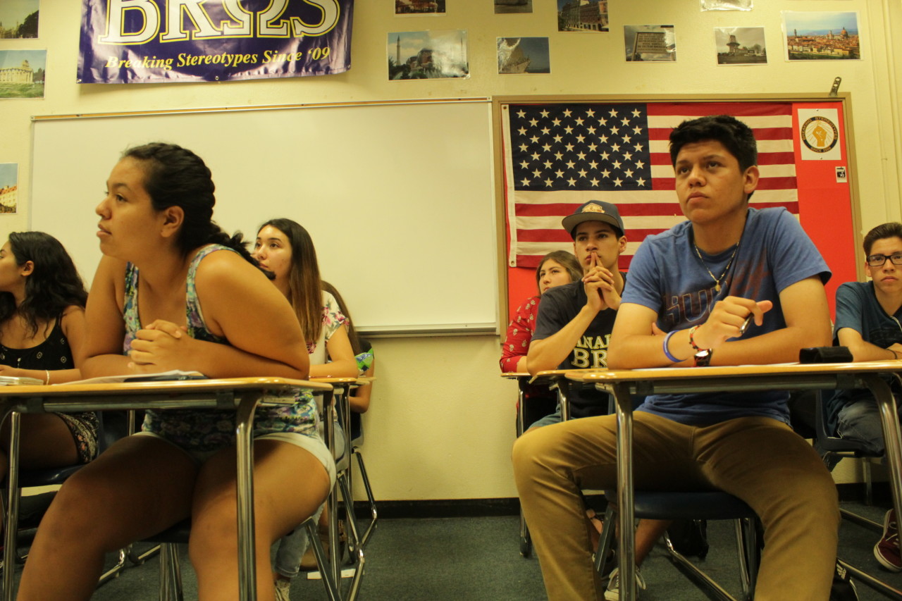 Seventeen-year-old Alma Perez , from left, and Sergio Nieto, 16 in blue shiirt, of Anaheim High School listen to a presentation from a representative of the Orange County Transportation Authority. Residents of Anaheim and Garden Grove are currently attending workshops to learn about how transportation goes from policy to reality.
