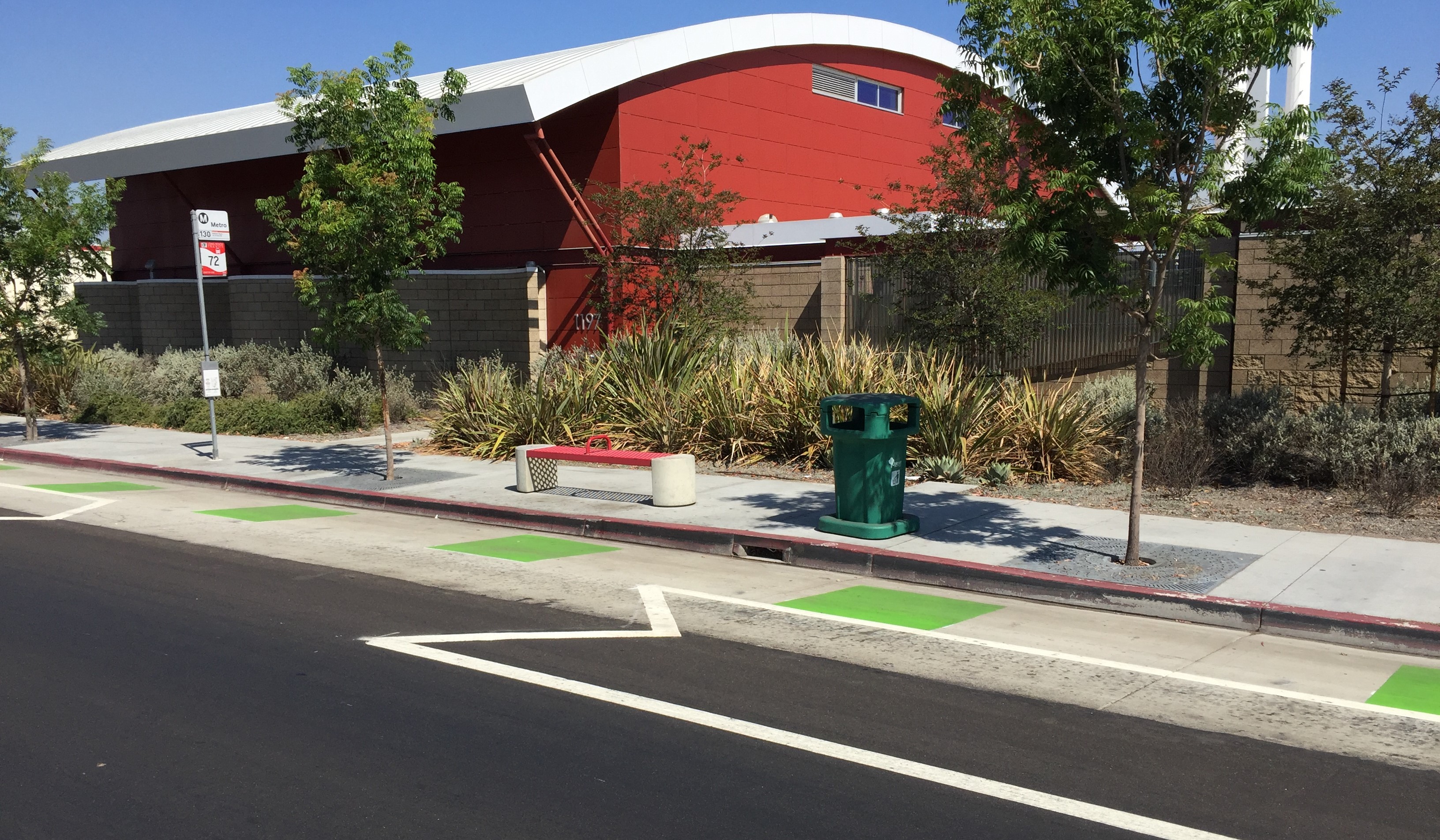 Example of unprotected merge zone at bus stops on Artesia Blvd protected bike lanes