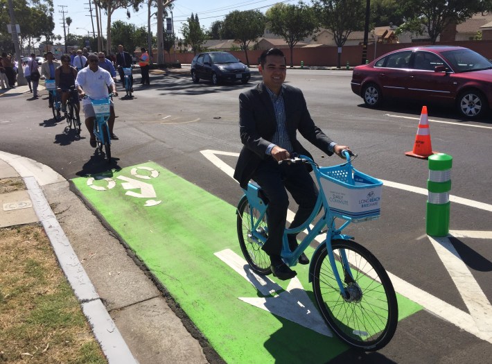 Long Beach Mayor Robert Garcia (center) and Vice Mayor Rex Richardson (left) tour the new Artesia Blvd protected bike lanes. Photos: Joe Linton/Streetsblog L.A.