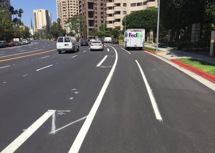 Buffered bike lane preliminary markings on Wilshire in Westwood