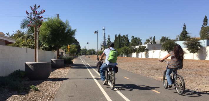 Cyclists riding the West Santa Ana Branch bike path in the city of Bellflower