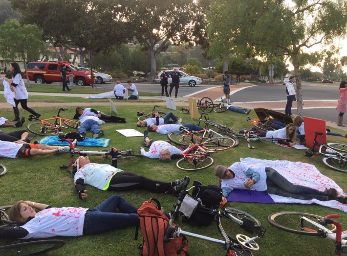 Uniformed police observed the cyclists die-in protest