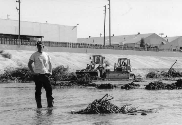 Lewis MacAdams surveying Army Corps of Engineers bulldozer damage to the L.A. River in Frogtown in the 1997. Photo by Blake Gumprecht via FoLAR