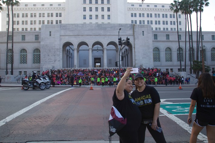 Runners take a selfie as the group assembles on the steps of City Hall for a photo. Sahra Sulaiman/Streetsblog L.A.