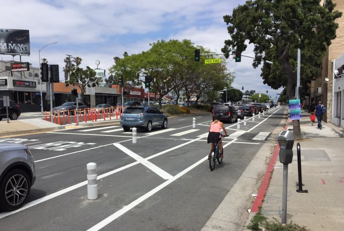 New mid-block crosswalk and parking-protected bike lane on Venice Blvd in Mar Vista. Photo: Joe Linton/Streetsblog L.A.