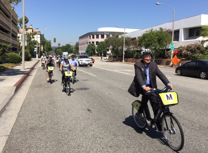 Metro boardmember and Duarte City Councilmember John Fasana (right) riding Metro Bike Share in Pasadena