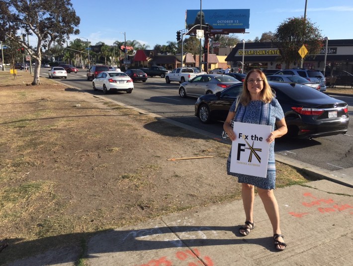 Fix the Fairfax Asterisk spokesperson Michelle Menna standing on the San Vicente Boulevard median island. Photo by Joe Linton/Streetsblog L.A.