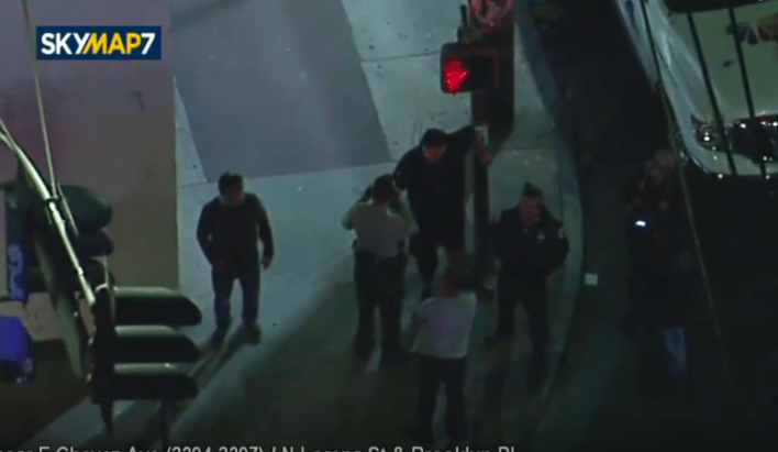 Isaiah is engaged by law enforcement. The men on the corner attempted to vouch for him, but were not listened to. Screen grab: https://youtube.com/watch?v=snZGrWZp03E