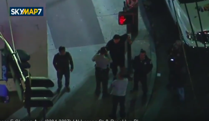 Isaiah is engaged by law enforcement. The men on the corner attempted to vouch for him, but were not listened to. Screen grab: https://youtube.com/watch?v=snZGrWZp03E