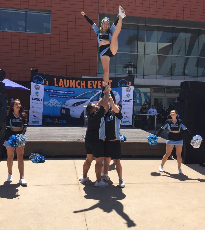 Cheerleaders celebrating the arrival of BlueLA electric car-share