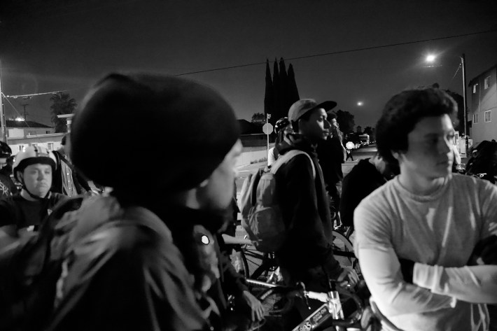 Riders sit in silence to pay their respects to Frazier's mother. Sahra Sulaiman/Streetsblog L.A.