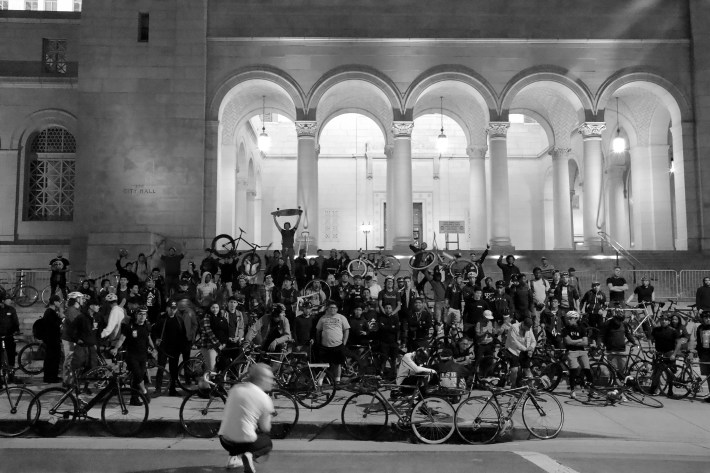 The memorial ride ended at city hall, where riders taped protest signs to barricades and plotted next moves. Sahra Sulaiman/Streetsblog L.A.
