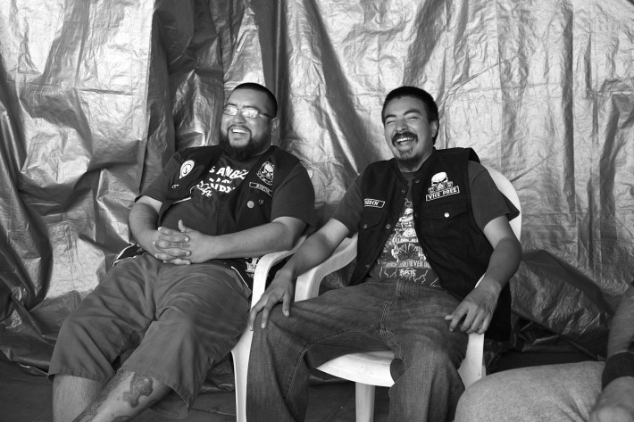 Juan Carlos Becerra and Carlos "Cheech" Garcia laugh at a club meeting in 2017. Sahra Sulaiman/Streetsblog L.A.