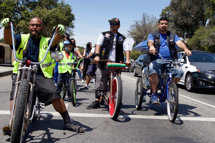 The club waits for a green light as they head toward Jordan Downs. Sahra Sulaiman/Streetsblog L.A.