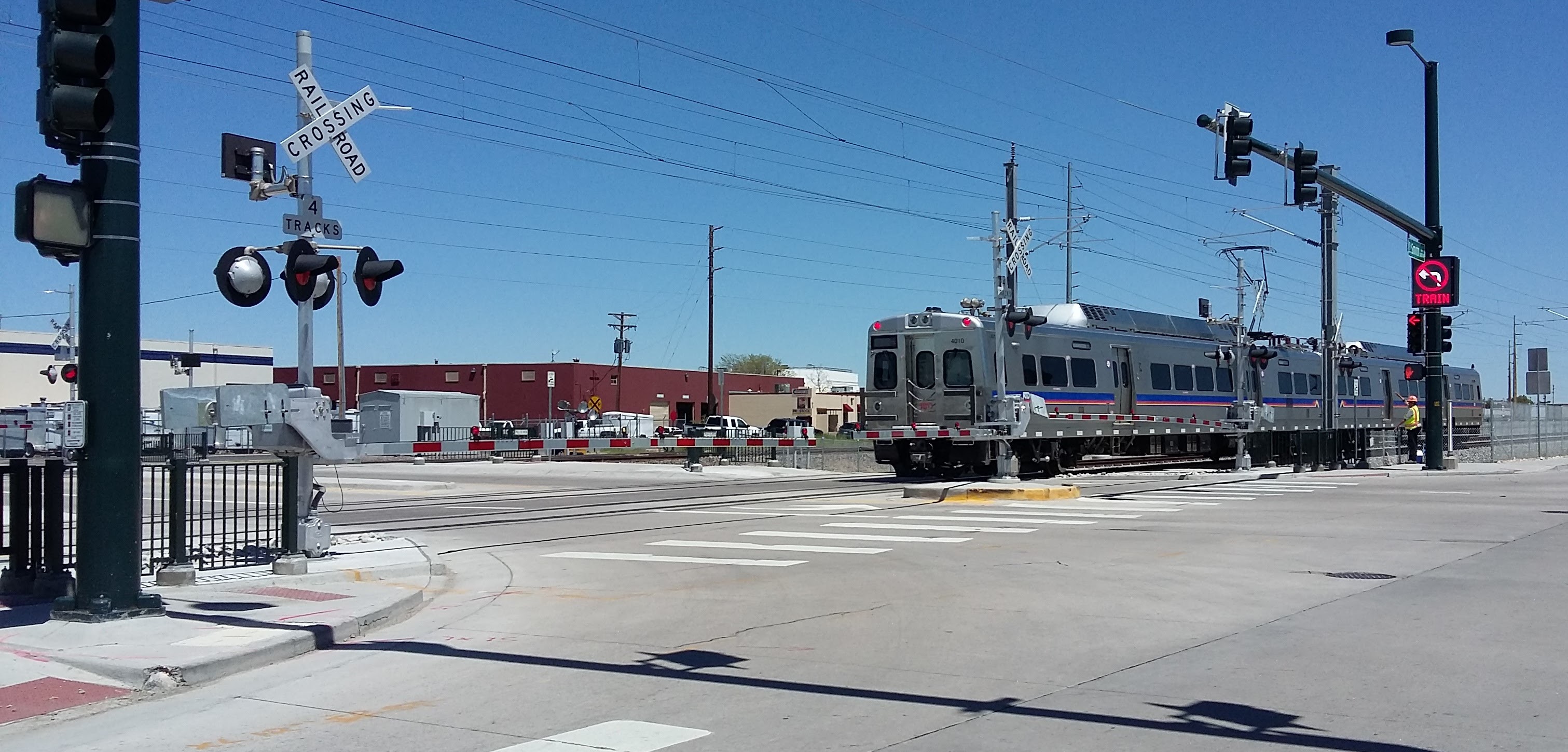 New Denver RTD electric-catenary heavy rail crossing at grade. Photo from Wikimedia Commons