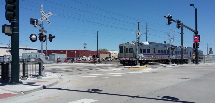 New Denver RTD electric-catenary heavy rail crossing at grade. Photo from Wikimedia Commons