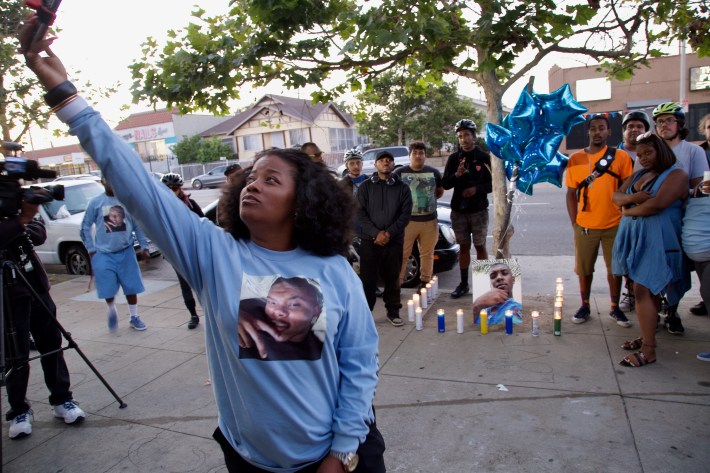 Family and friends gathered at the site where Woon was killed wearing shirts with his image on it. The ghost bike placed at the crash site in April was stolen some time ago. Sahra Sulaiman/Streetsblog L.A.