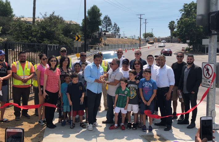 Councilmember Huizar (center light blue shirt) with El Sereno community leaders cutting the ribbon on the Alhambra Avenue Safety Improvements