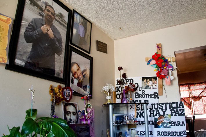 The altar to Cesar Rodríguez takes up the corner of one room. The dried roses (at center) were a gift from Rodríguez to his mother on Mother's Day last year. Sahra Sulaiman/Streetsblog L.A.
