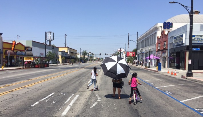 A family cruising Pacific Boulevard at Sunday's open streets event