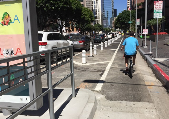 L.A.'s MyFigueroa project is open. Features include protected bike lanes and transit islands. Photos by Joe Linton/Streetsblog L.A.