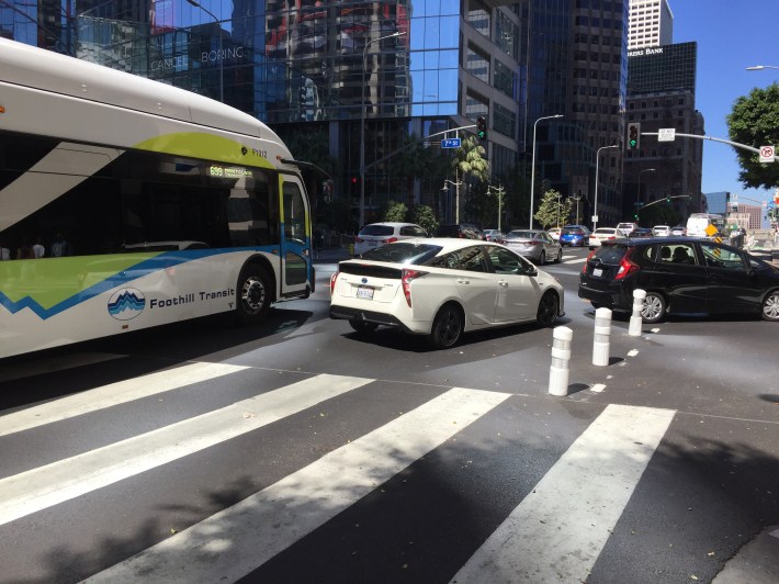 This Foothill Transit bus had to merge out of the bus-only lane to get around the car driver blocking the lane