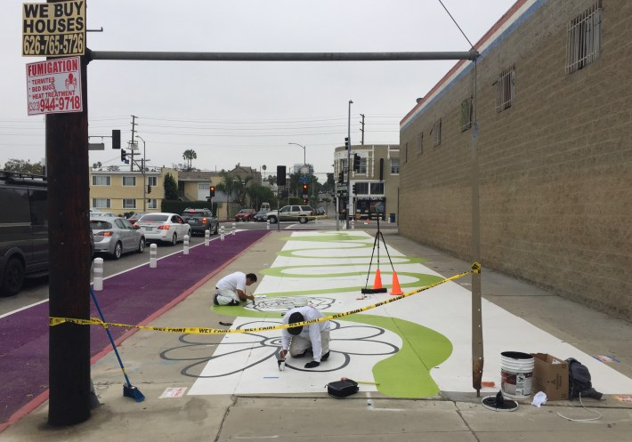 Coloring Book plaza sidewalk mini-park in progress (and long painted curb extension) on Hauser at Pico
