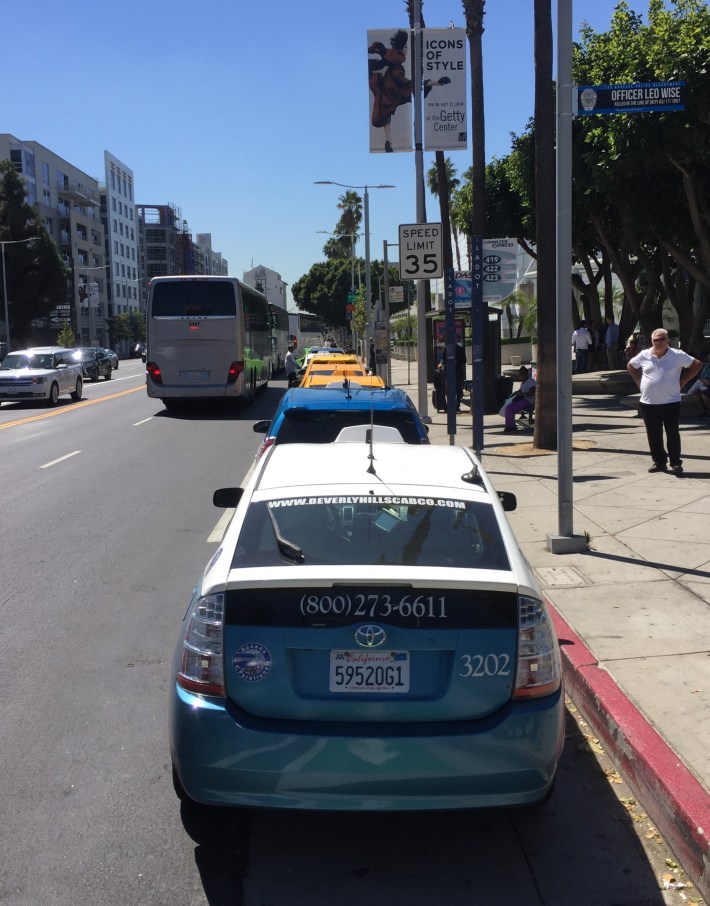 Eight taxis in the MyFigueroa bike lane last Friday