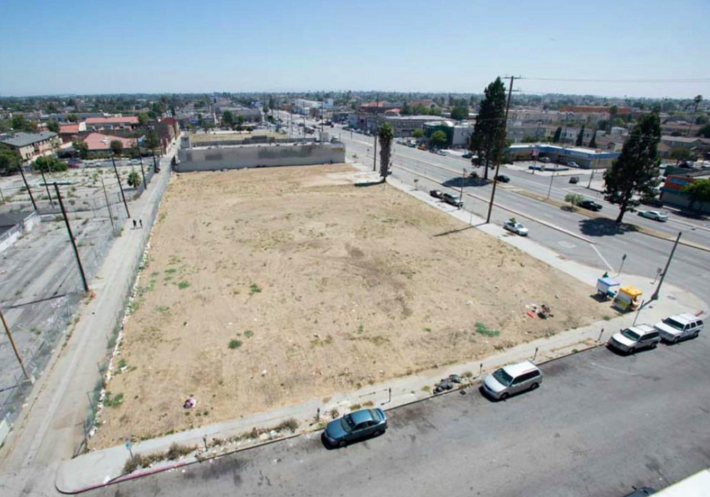 The vacant lots encompassing the 8400 and 8500 blocks on Vermont have held the community hostage to blight for over 26 years. The 8300 block (from which this photo was taken) had also remained vacant for a number of years and was originally going to be incorporated into the Vermont Entertainment Village project. In the mid-2000s, Eli Sasson sold off his 8300 block parcels (helping to doom the mall project) and the County services building rose on it instead in 2007. Source: County Supervisor Mark Ridley-Thomas