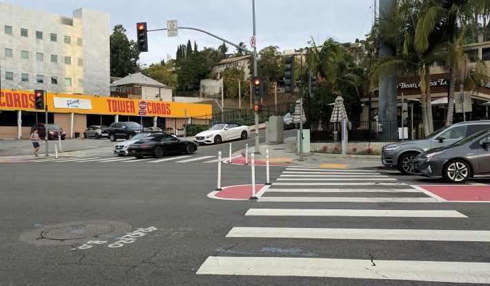 Pedestrian refuge island and painted curb extensions - at Sunset and Holloway