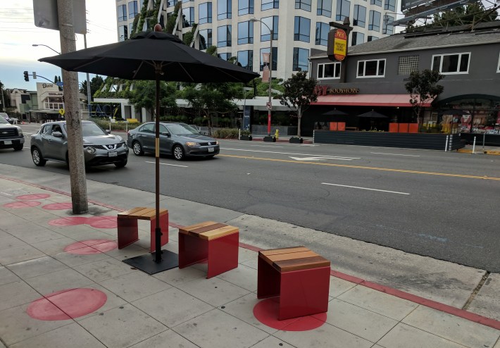 Seating area in foreground and parklet in background - on Sunset between Holloway and Larrabee