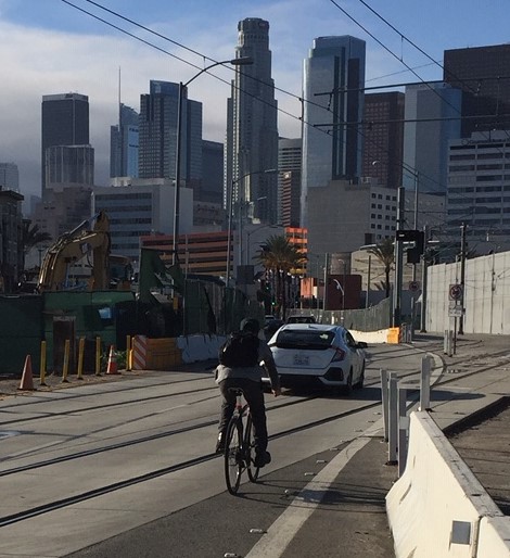 Cyclist (safely) crossing Metro Gold Line tracks yesterday