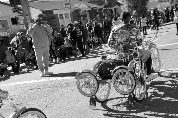 The Real Rydaz can't go five feet without someone wanting a photo. Here, a bystander snaps Holloway and his bike. Sahra Sulaiman/Streetsblog L.A.