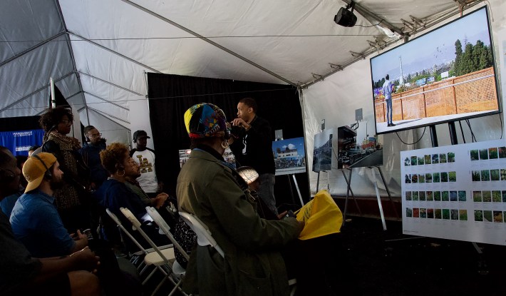 Exhibit and Art Curation Manager Malcolm Davis introduces community members to the plans for Destination Crenshaw at the King Day festivities in Leimert Park this past January. Sahra Sulaiman/Streetsblog L.A.