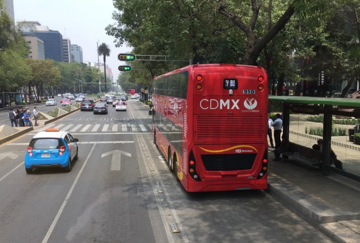 Double-decker Metrobus running in right-lane bus-only lane on Reforma