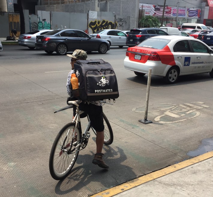 Bicycle delivery messenger in Mexico City