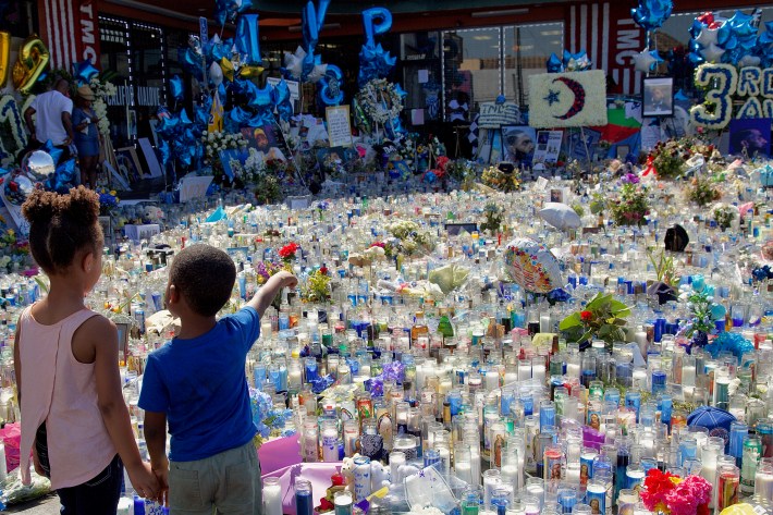 The memorial to Nipsey Hussle sits in front of The Marathon store in the strip mall where he spent much of his life and where he worked to uplift the community. He died here March 31. Sahra Sulaiman/Streetsblog L.A.