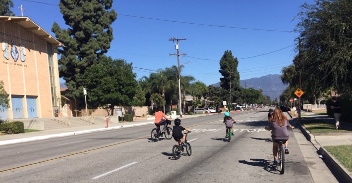 Families bicycling on car-free streets at 626 Golden Streets
