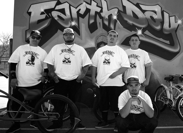 J.P., at left, with some of the members of Los Ryderz during a ride pit-stop at Normandie Elementary in 2013. Sahra Sulaiman/Streetsblog L.A.