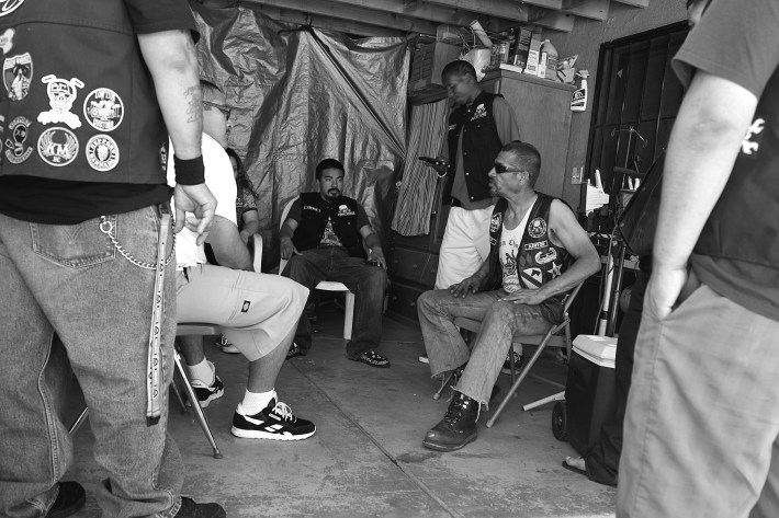 Art at a meeting with some of Los Ryderz' core members including Slimm (standing), Cheech (center), Cholo (seated, at left), and J.P. (standing, at left). Sahra Sulaiman/Streetsblog L.A.