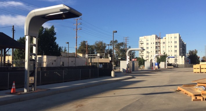 Electric bus charging infrastructure under construction at NoHo Orange Line Station. Photo by Joe Linton/Streetsblog L.A.