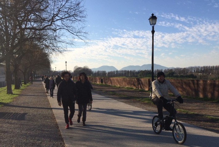 Shared walk/bike path atop the old city walls in Lucca, Italy