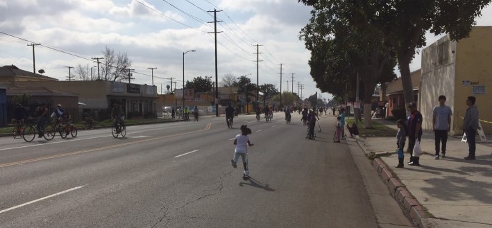 Young girl scootering down Central Avenue at yesterday's CicLAvia - South L.A.