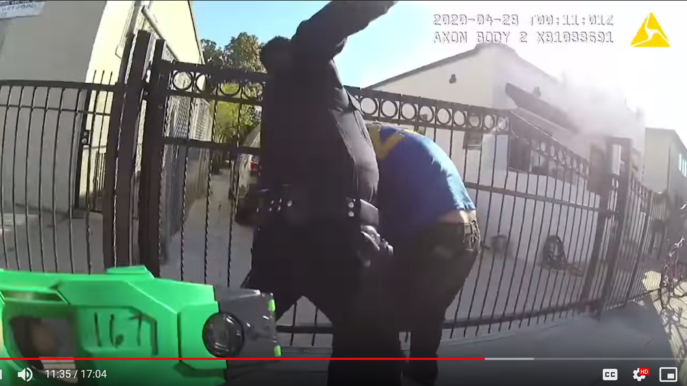 Officer Frank Hernández rains blows down on Richard Castillo while his partner stands by with her taser ready in Boyle Heights on April 27. Image captured from LAPD body cam footage.