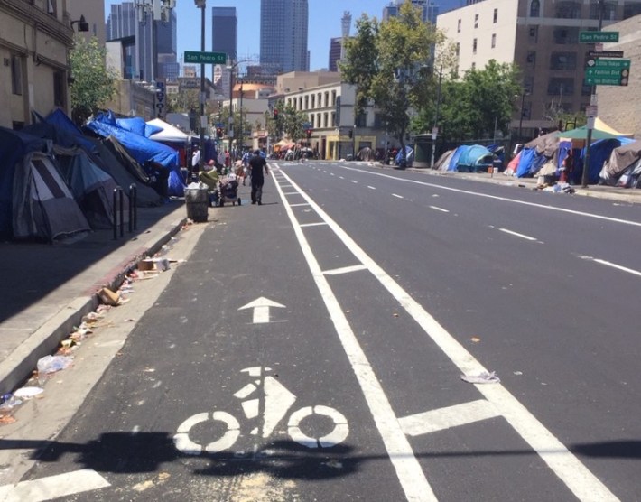 East of Main Street, the project includes protected bike lanes, which have been striped, but bollards have not been installed yet