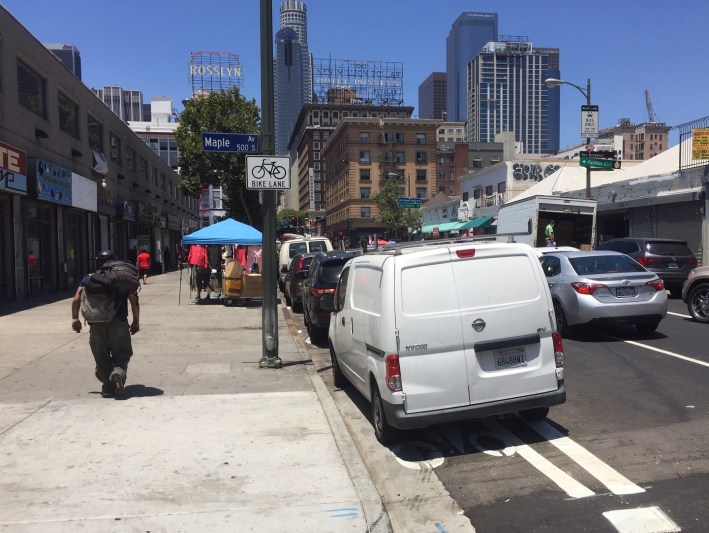 As of today, with no bollards installed some drivers are parking in the 5th Street bike lane