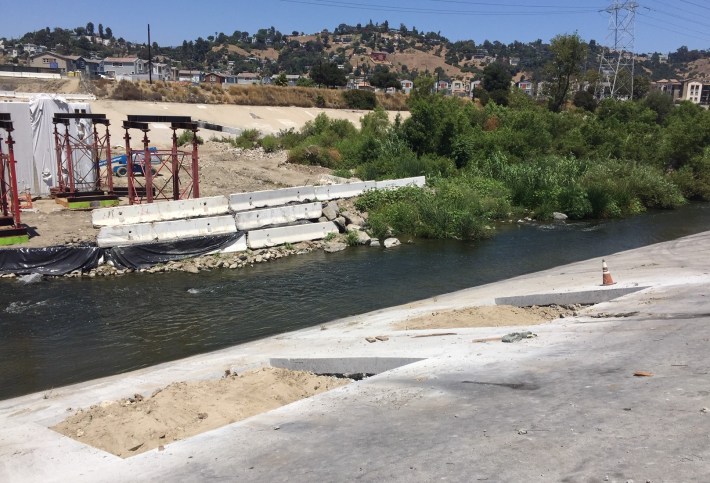 Channel wall cuts to hold temporary falsework