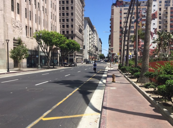 5th Street along Pershing Square. The yellow striping is a fog line, which makes it clear that there is enough space for a bike lane.