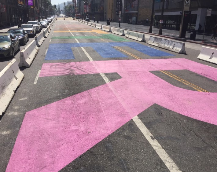 The letters were and are painted in the colors of the transgender, nonbinary and pride flags