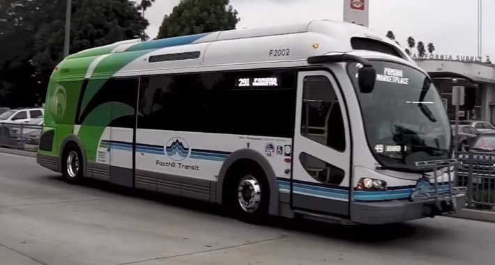 A 2013 Foothill Transit electric bus with its telltale green-blue splash. Image via YouTube